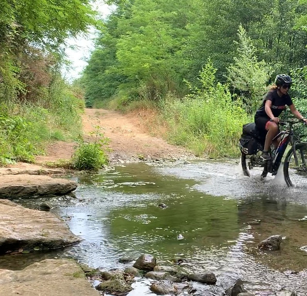 Biking in the nature, crossing a small river
